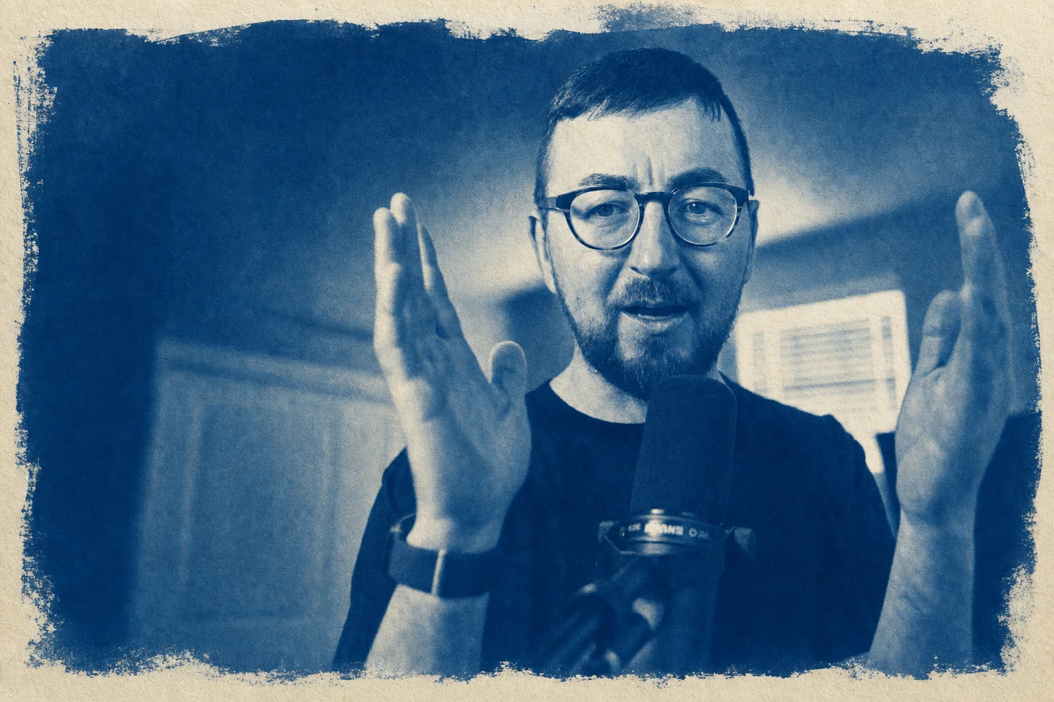 Cyanotype portrait of Gareth explaining an idea with his hands