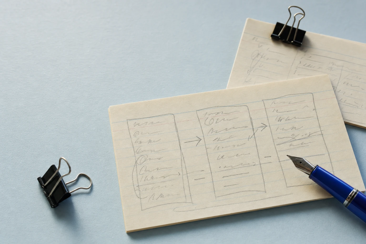 Illustrative process sketch on index cards with a blue fountain pen