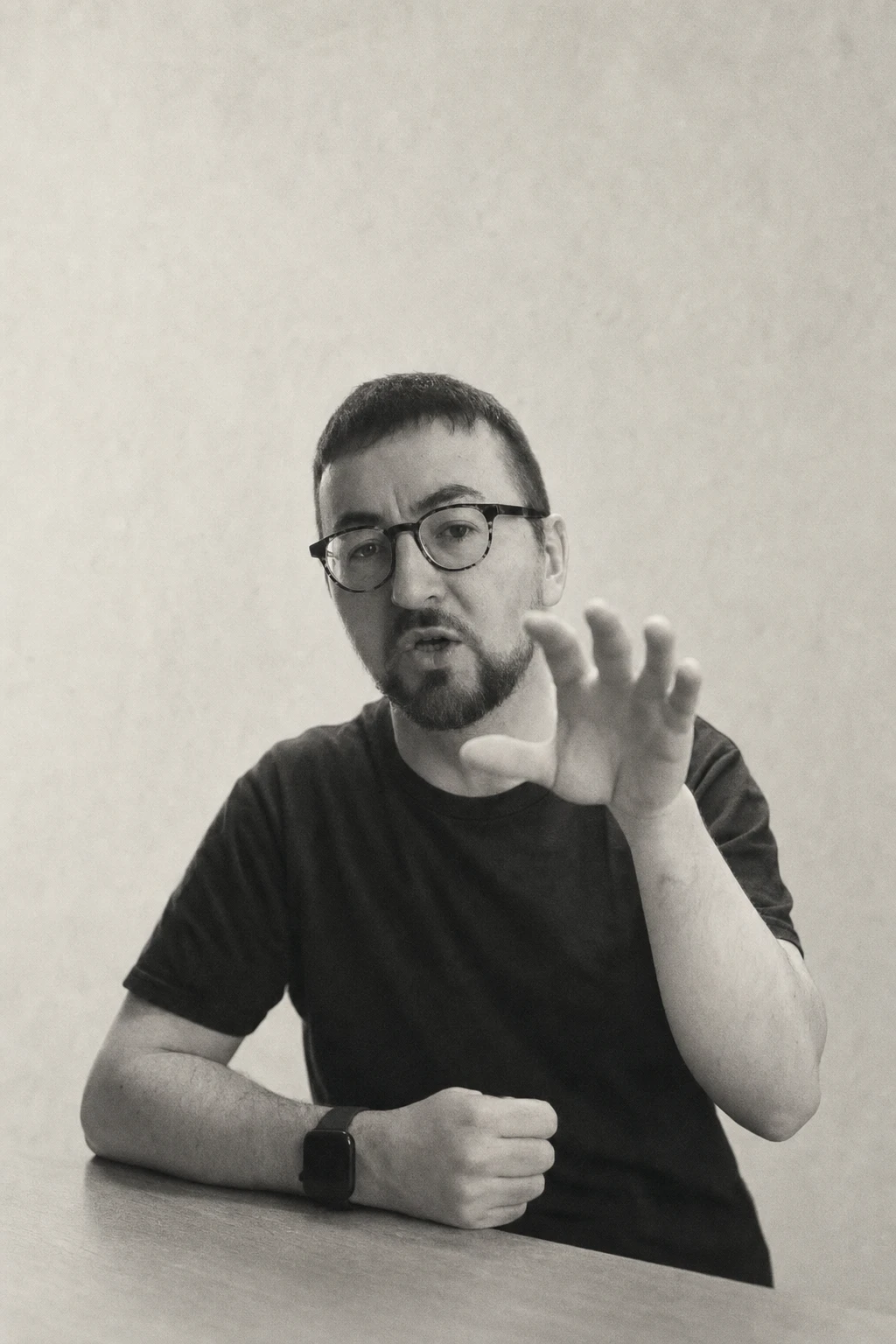AI-treated portrait of Gareth, wearing glasses and gesturing as he speaks.