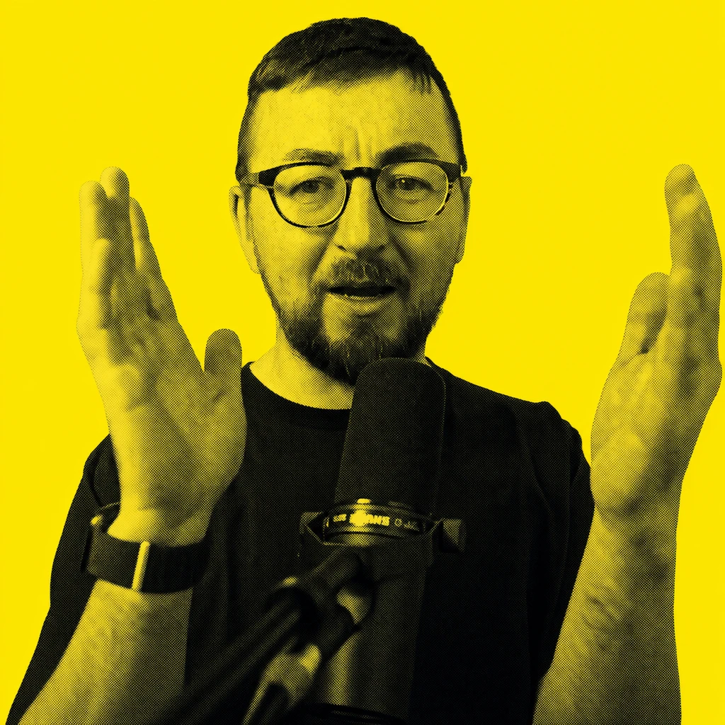 A halftone portrait of Gareth, gesturing with both hands beside his microphone